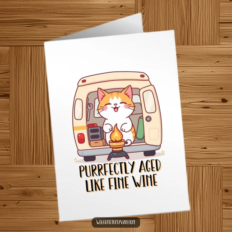 Funny Free Printable Birthday Card: A determined cat gleefully setting up a small camping stove outside a van, ready to cook.