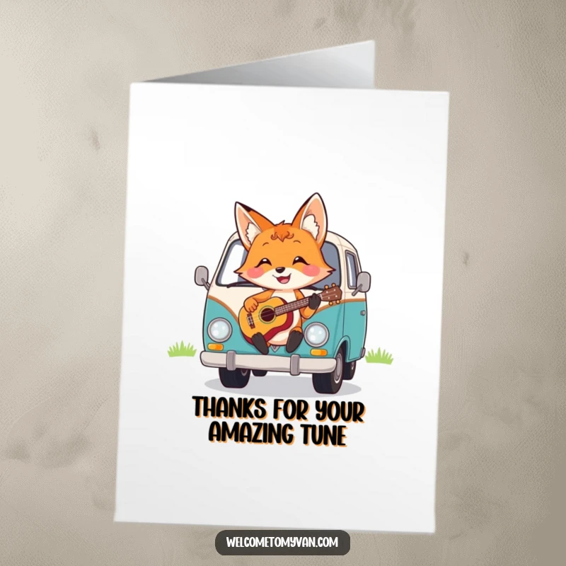 Funny Free Printable Thank You Card: A cheerful fox happily strumming a ukulele on the hood of a van, sending thanks.